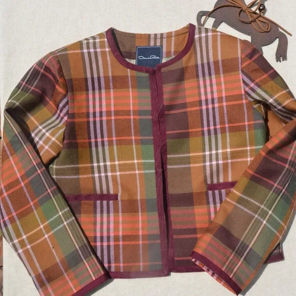 Oscar de la Renta jacket of 100% Wool, plaid pattern with claret grosgrain ribbo